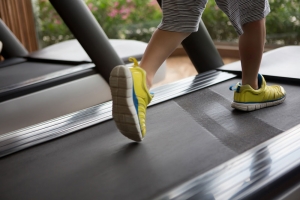 child running on treadmill
