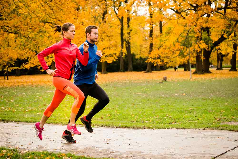 couple running in fall