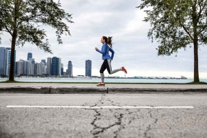 runner running through city