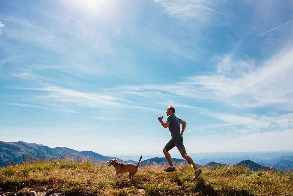 Male runner and dog