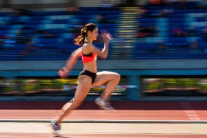 woman sprinting on a track