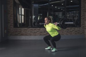 Woman athlete lifting weights