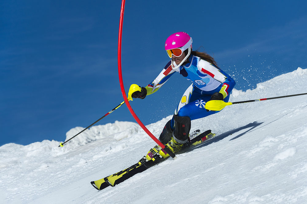 Young female slalom skier during the race