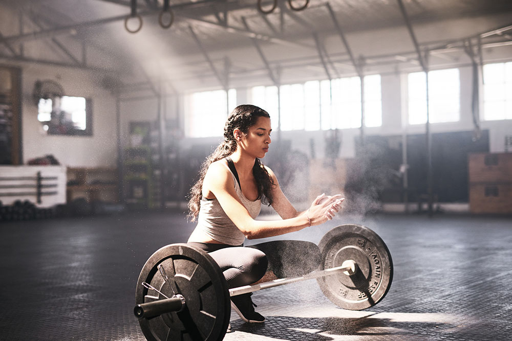 Woman weightlifting with barbell