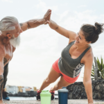 Exercise partners congratulating each other during workout